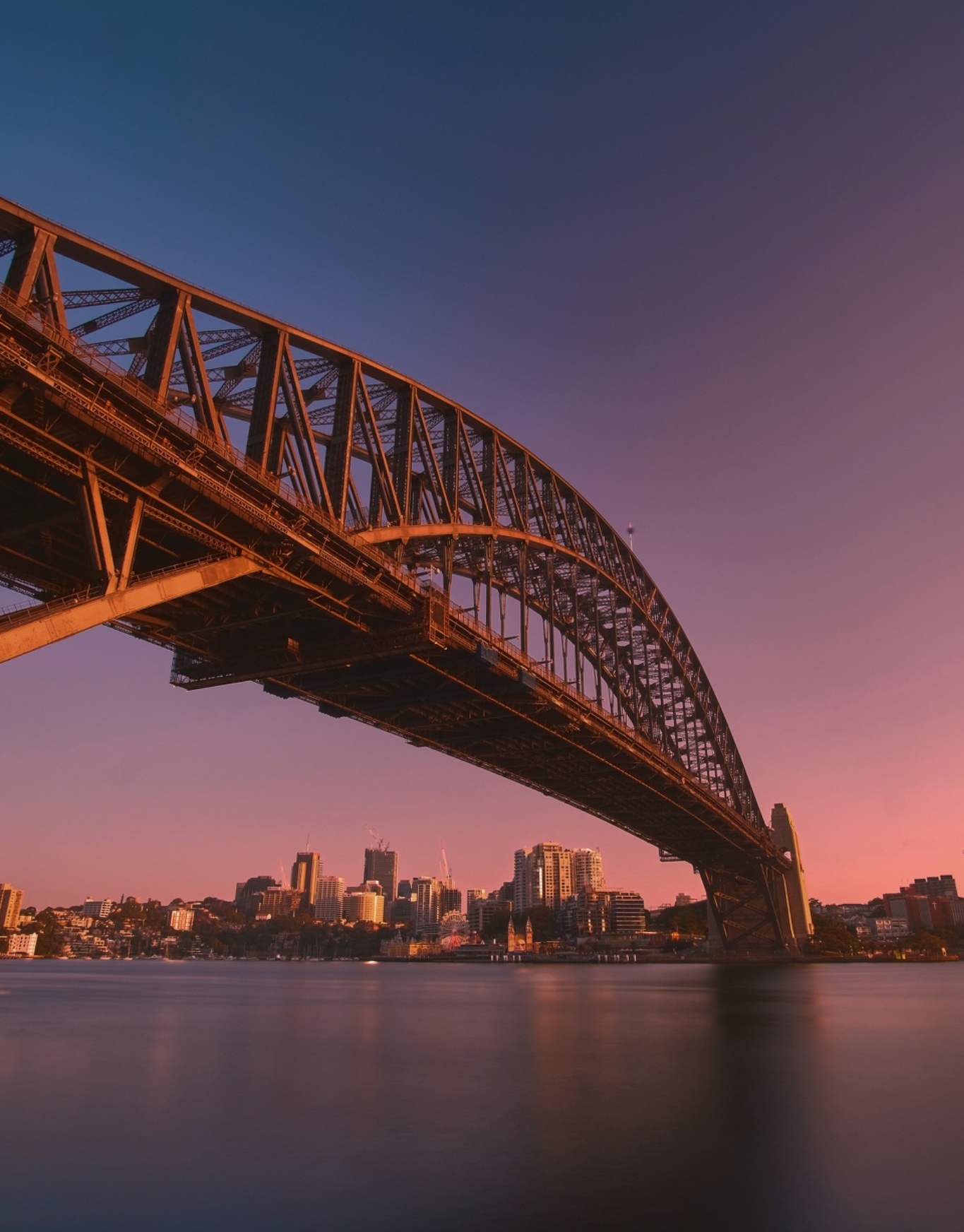 Sydney Harbour Bridge at dusk, shown as a monochrome hero image